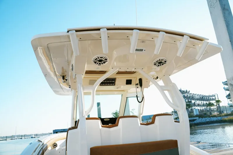 Slide: The Image of 2021 Scout 355 LXF boat with sleek design and modern features. - 16