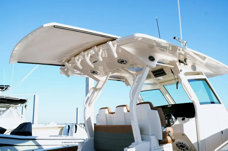 Slide: The Image of 2021 Scout 355 LXF boat with sleek design and modern features. - 17