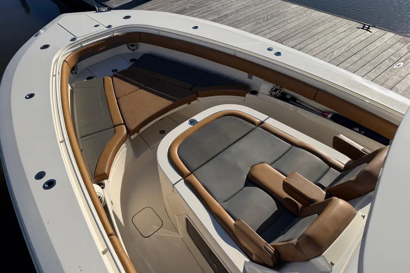Slide: The Image of 2021 Scout 355 LXF boat interior with luxurious seating and sleek design. - 38