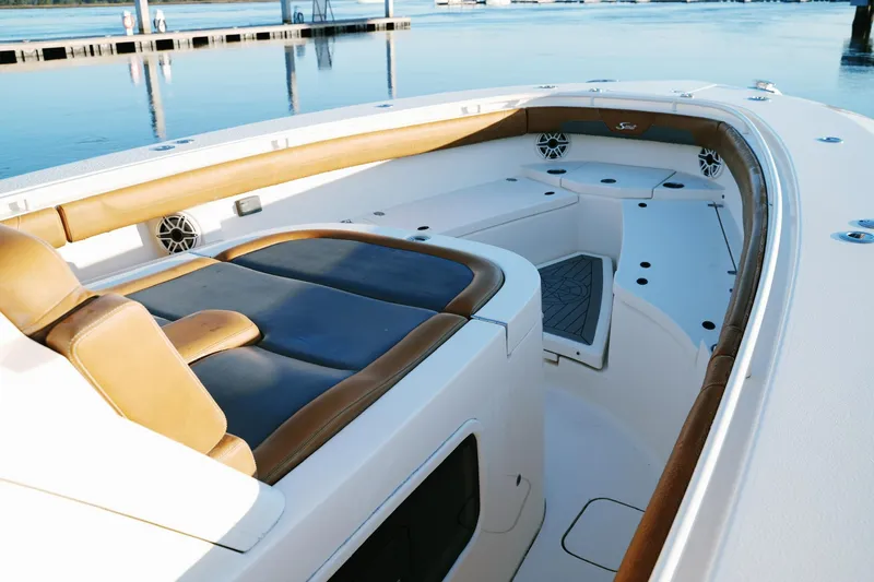 Slide: The Image of 2021 Scout 355 LXF boat interior with luxurious seating and sleek design. - 41