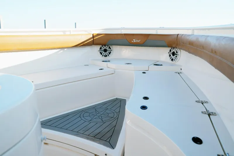 Slide: The Image of 2021 Scout 355 LXF boat interior with cushioned seating and modern design. - 43