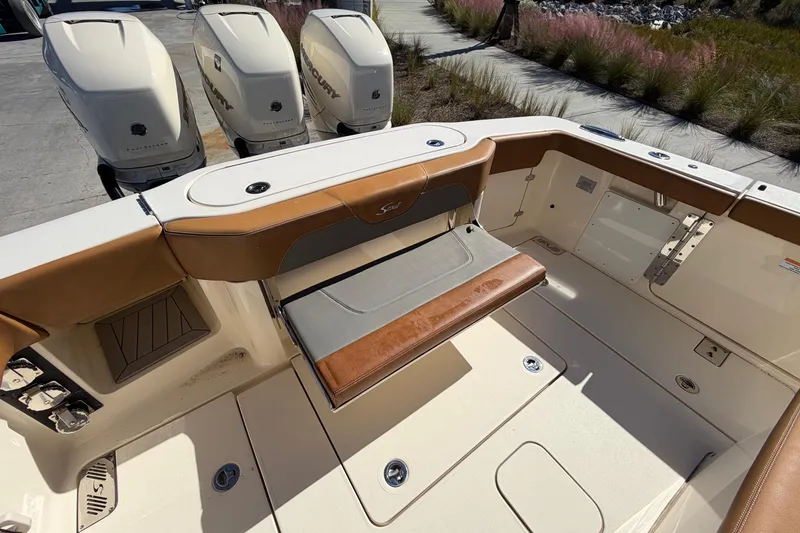 Slide: The Image of 2021 Scout 355 LXF boat interior with seating and Mercury engines. - 46
