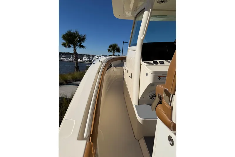 Slide: The Image of 2021 Scout 355 LXF boat interior with sleek design and luxurious seating. - 51
