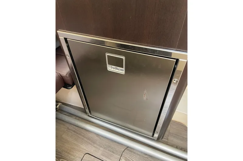 Slide: The Image of Stainless steel fridge in 2021 Scout 355 LXF boat interior. - 63