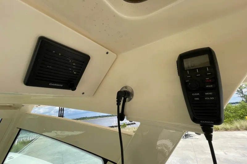 Slide: The Image of 2021 Scout 355 LXF boat with Garmin marine radio and speaker system. - 66