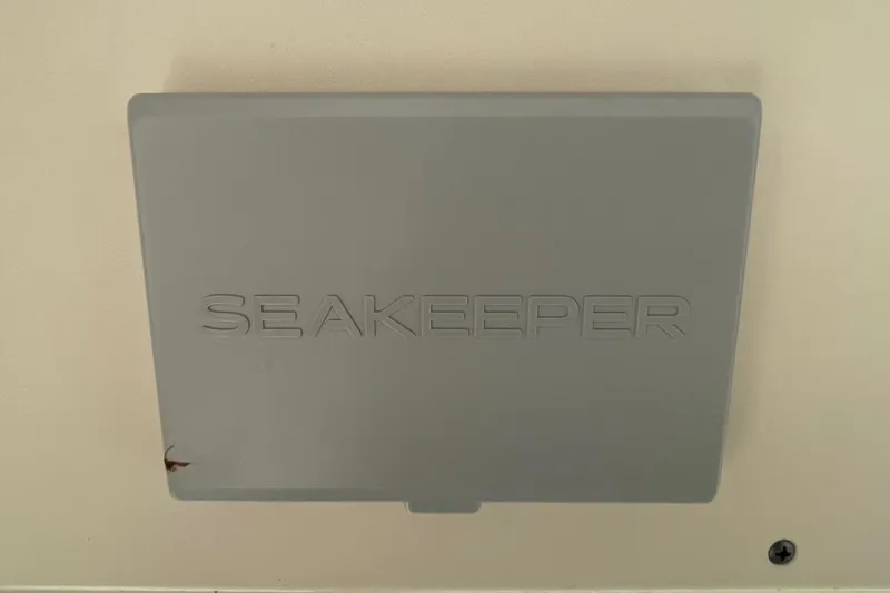 Slide: The Image of Gray Seakeeper panel on 2021 Scout 355 LXF boat interior. - 68