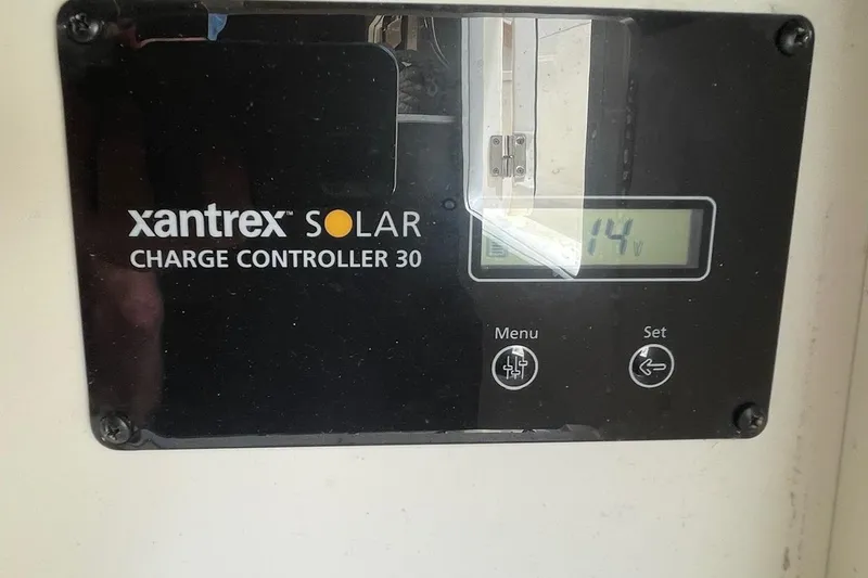 Slide: The Image of Xantrex Solar Charge Controller 30 displaying 14 volts on a 2021 Scout 355 LXF. - 73