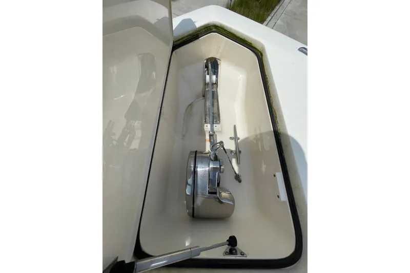 Slide: The Image of Anchor compartment of 2021 Scout 355 LXF boat, featuring stainless steel hardware. - 75