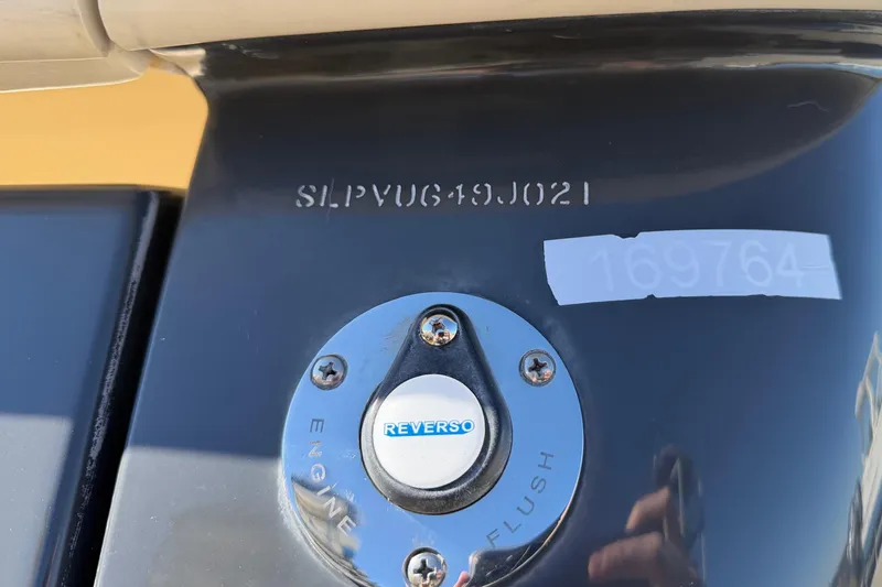 Slide: The Image of 2021 Scout 355 LXF boat engine flush port with serial number. - 78