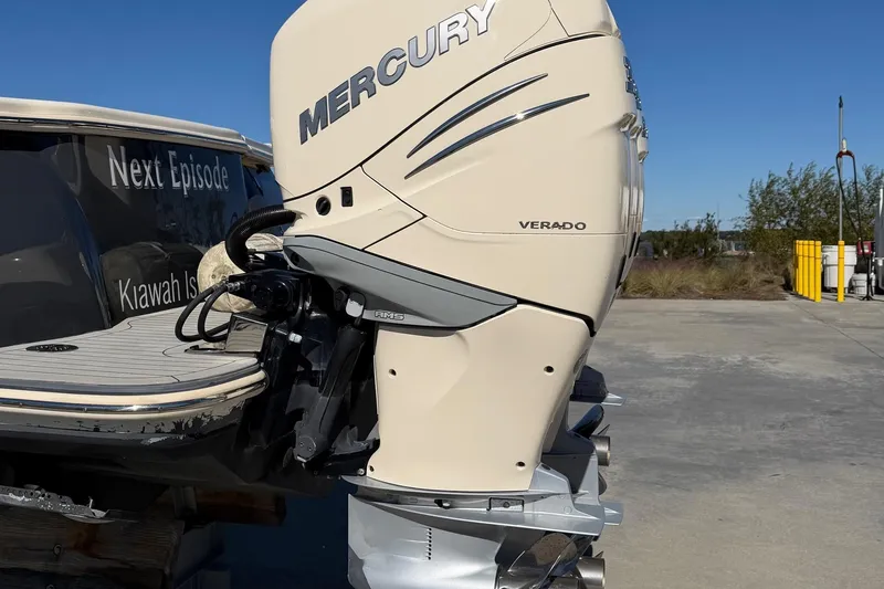 Slide: The Image of 2021 Scout 355 LXF boat with Mercury Verado outboard engine, docked outdoors. - 79