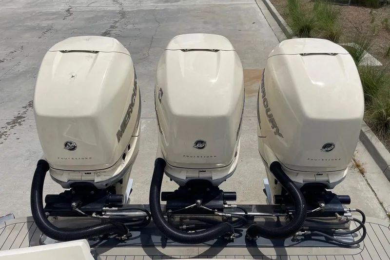Slide: The Image of Triple Mercury outboard engines on a 2021 Scout 355 LXF boat. - 81
