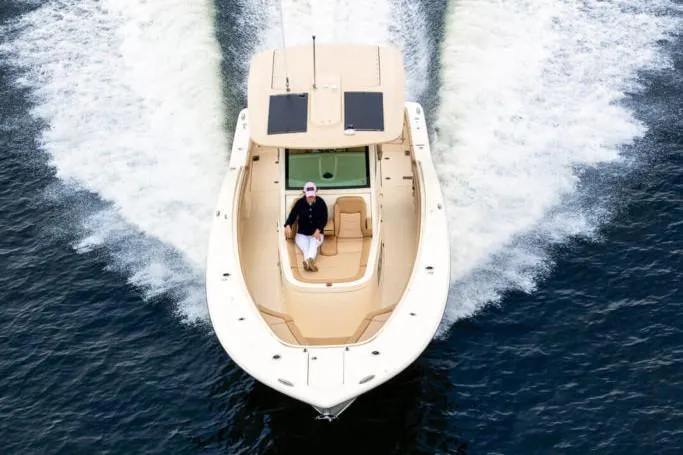 Slide: The Image of Manufacturer Provided Image: 2021 Scout 355 LXF boat cruising on water, top view. - 89