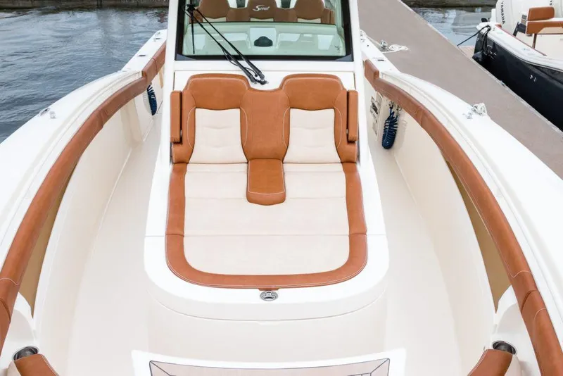 Slide: The Image of Manufacturer Provided Image: 2021 Scout 355 LXF boat with luxurious tan and white seating. - 96