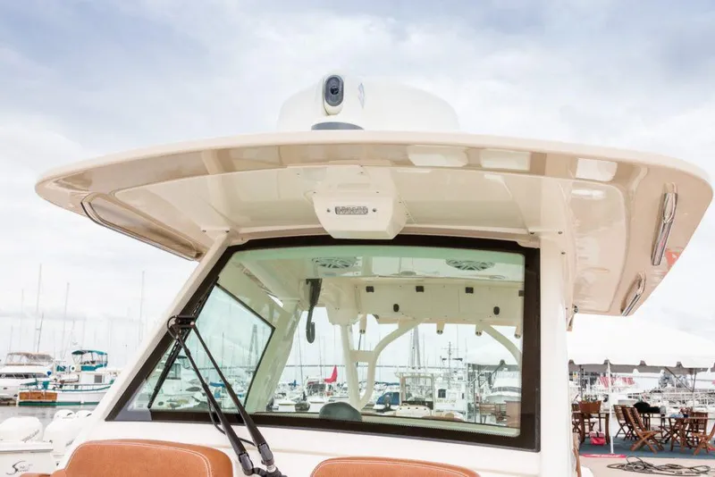 Slide: The Image of Manufacturer Provided Image: 2021 Scout 355 LXF boat at marina, rear view of helm station. - 98