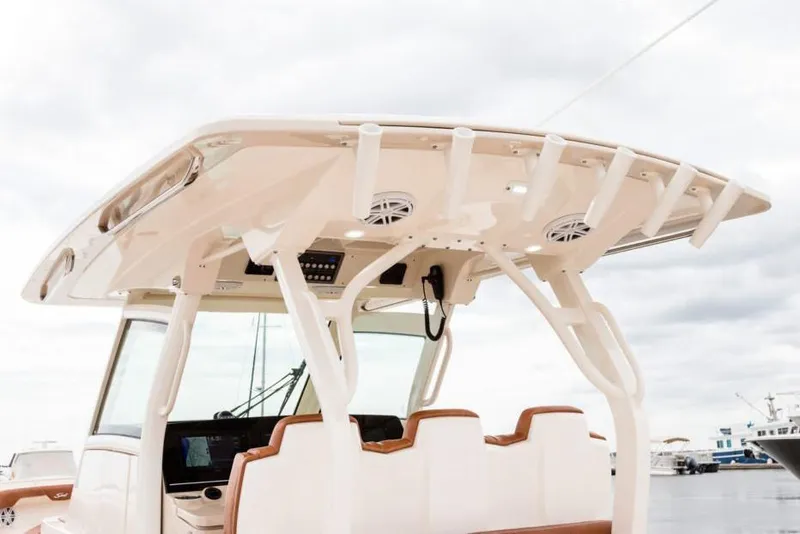 Slide: The Image of Manufacturer Provided Image: 2021 Scout 355 LXF boat interior with helm station and seating. - 99