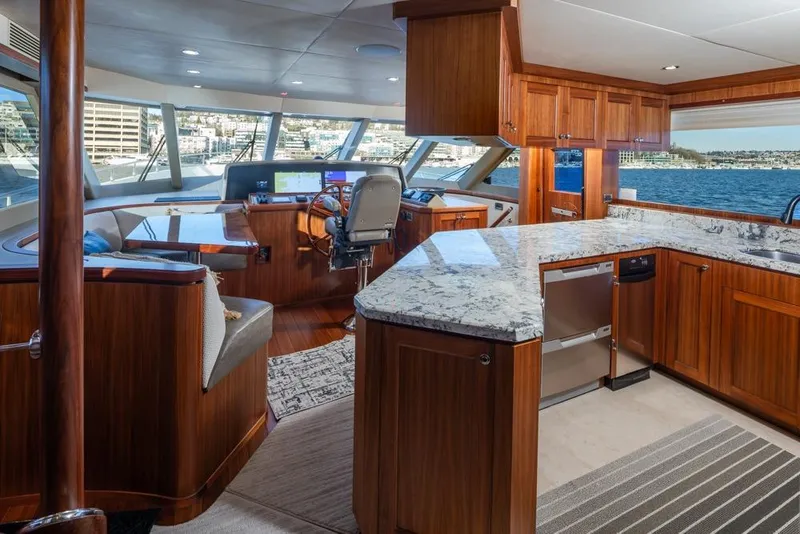 Slide: The Image of Luxurious interior of 2014 Ocean Alexander 85 Cockpit Motoryacht with modern helm and kitchen. - 10
