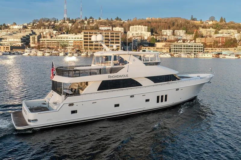 Slide: The Image of 2014 Ocean Alexander 85 Cockpit Motoryacht cruising on a scenic waterfront. - 13