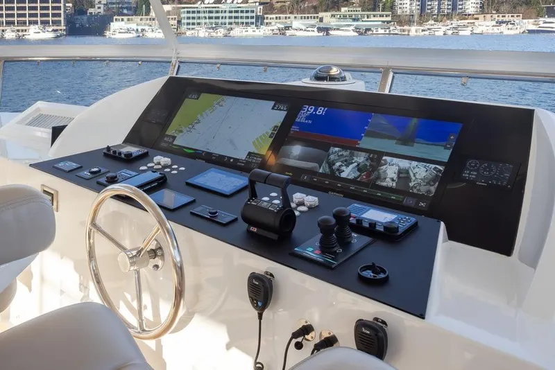 Slide: The Image of Cockpit of 2014 Ocean Alexander 85 Motoryacht with advanced navigation controls and displays. - 14