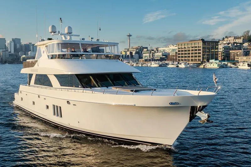 Slide: The Image of 2014 Ocean Alexander 85 Cockpit Motoryacht cruising near city skyline. - 15