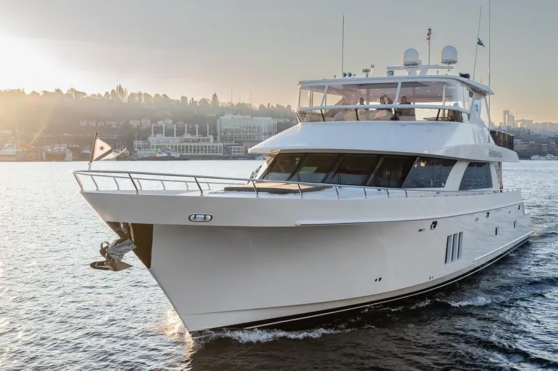 Slide: The Image of 2014 Ocean Alexander 85 Cockpit Motoryacht cruising on calm waters at sunset. - 17