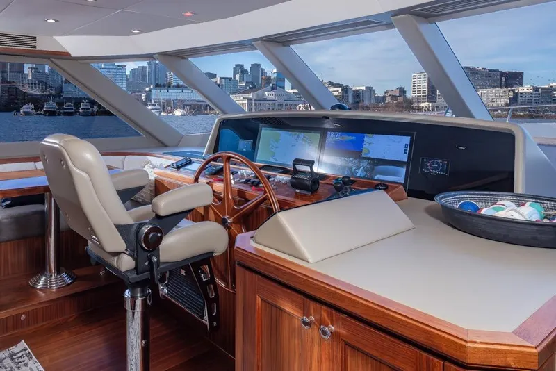 Slide: The Image of Helm of 2014 Ocean Alexander 85 Cockpit Motoryacht with city skyline view. - 18