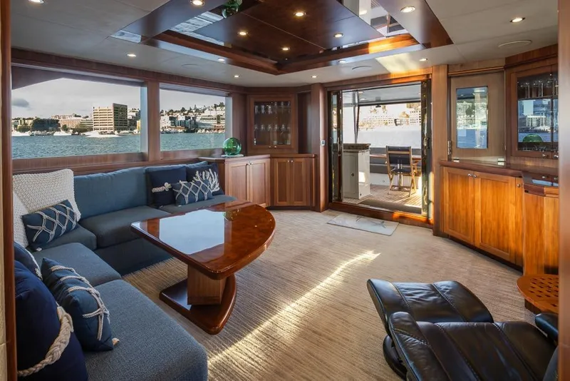 Slide: The Image of Luxurious interior of 2014 Ocean Alexander 85 Cockpit Motoryacht with elegant wood finishes and waterfront view. - 2
