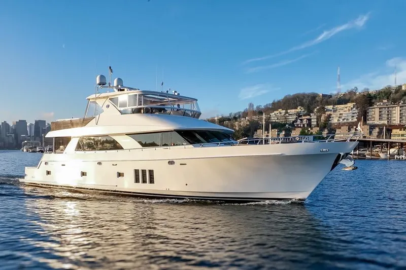 Slide: The Image of 2014 Ocean Alexander 85 Cockpit Motoryacht cruising on a sunny day near cityscape. - 26