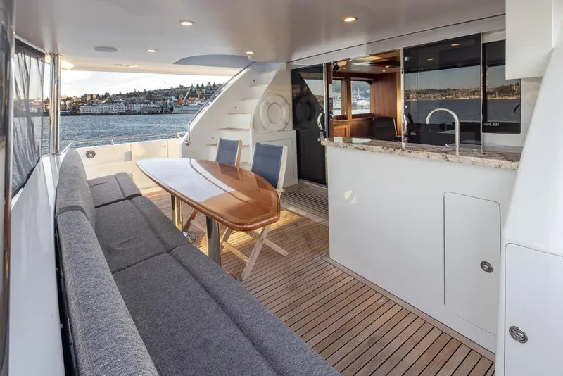 Slide: The Image of Luxurious 2014 Ocean Alexander 85 Cockpit Motoryacht with elegant outdoor seating and scenic views. - 27