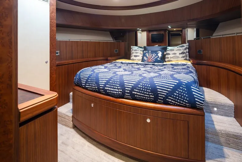 Slide: The Image of Luxurious bedroom interior of 2014 Ocean Alexander 85 Cockpit Motoryacht with elegant wood finish. - 28