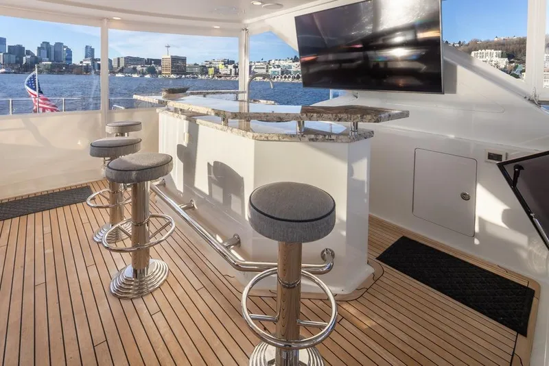 Slide: The Image of Luxurious 2014 Ocean Alexander 85 Cockpit Motoryacht with elegant bar and scenic waterfront view. - 40