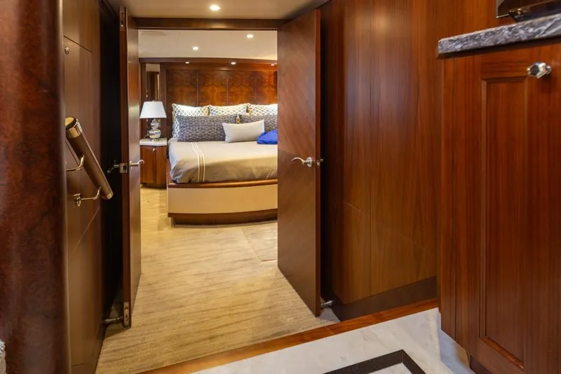 Slide: The Image of Luxurious bedroom interior of 2014 Ocean Alexander 85 Cockpit Motoryacht with elegant wood finishes. - 44