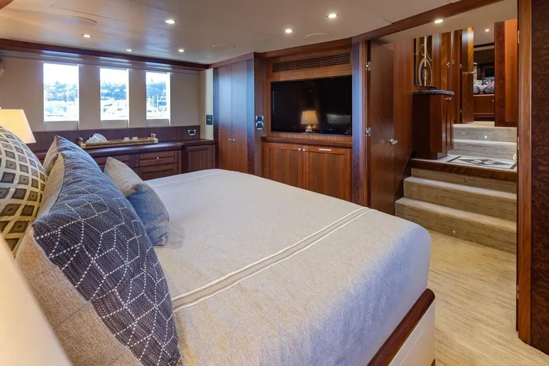 Slide: The Image of Luxurious bedroom interior of 2014 Ocean Alexander 85 Cockpit Motoryacht with elegant wood finishes. - 47