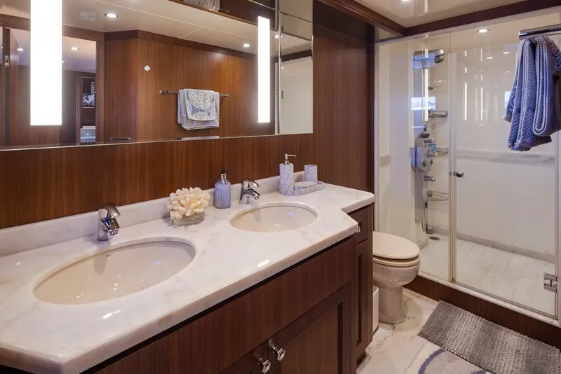 Slide: The Image of Luxurious bathroom in 2014 Ocean Alexander 85 Cockpit Motoryacht with dual sinks and glass shower. - 48