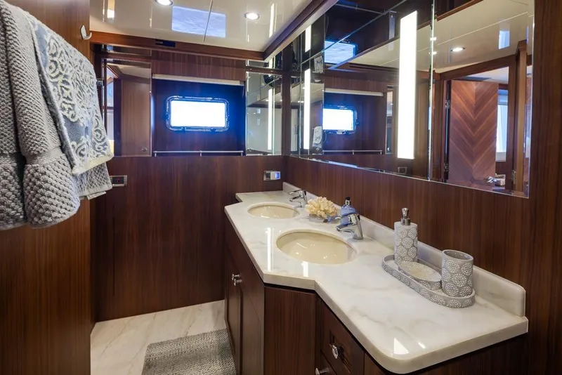 Slide: The Image of Luxurious bathroom in 2014 Ocean Alexander 85 Cockpit Motoryacht with dual sinks and elegant decor. - 49