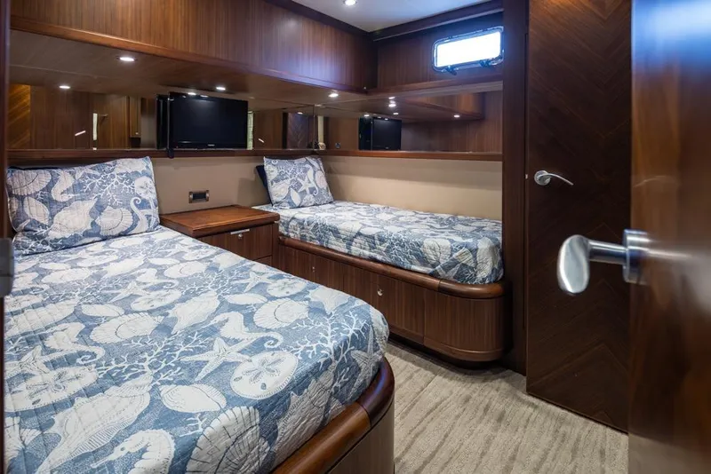Slide: The Image of Luxurious twin cabin in 2014 Ocean Alexander 85 Cockpit Motoryacht with nautical-themed bedding. - 50