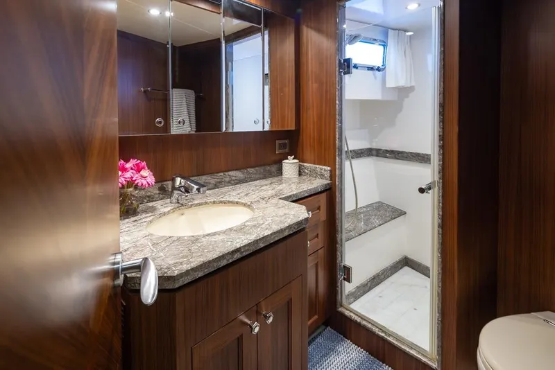 Slide: The Image of Luxurious bathroom in 2014 Ocean Alexander 85 Cockpit Motoryacht with marble countertop and shower. - 51