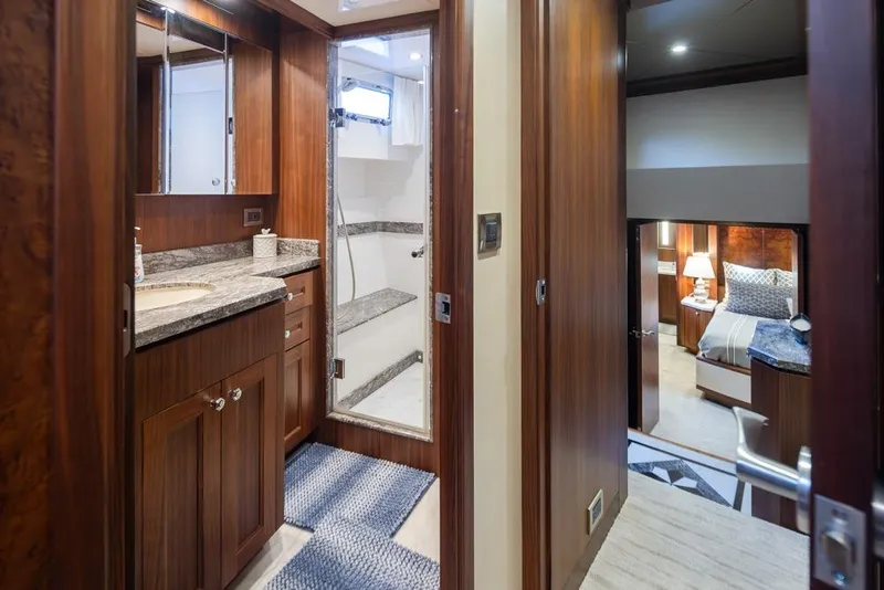 Slide: The Image of Luxurious interior of 2014 Ocean Alexander 85 Cockpit Motoryacht featuring wood finishes and elegant design. - 53