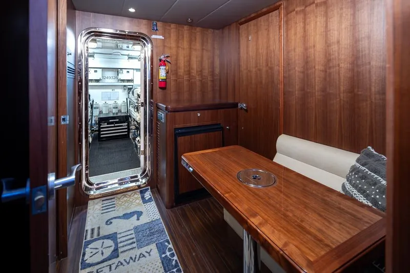 Slide: The Image of Luxurious interior of 2014 Ocean Alexander 85 Cockpit Motoryacht with wood paneling and seating area. - 57