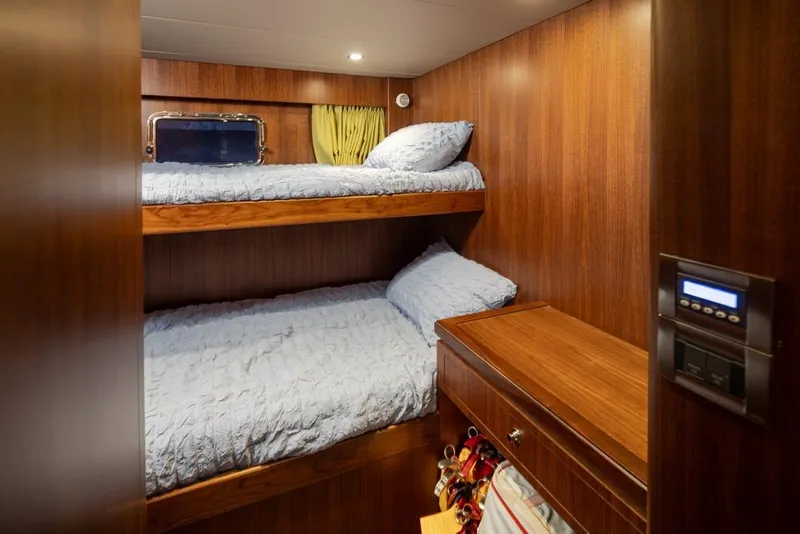 Slide: The Image of Bunk beds in 2014 Ocean Alexander 85 Cockpit Motoryacht cabin with wood paneling. - 58