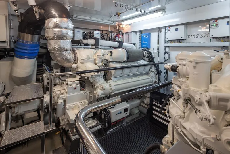 Slide: The Image of Engine room of 2014 Ocean Alexander 85 Cockpit Motoryacht, featuring advanced machinery and equipment. - 60