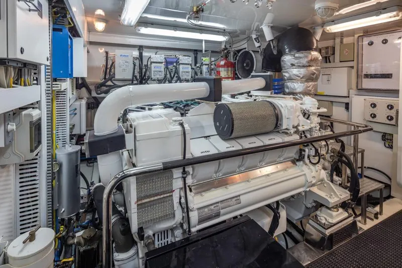 Slide: The Image of Engine room of 2014 Ocean Alexander 85 Cockpit Motoryacht, featuring advanced machinery and equipment. - 61