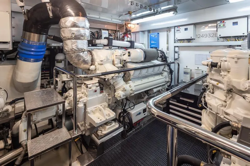 Slide: The Image of Engine room of 2014 Ocean Alexander 85 Cockpit Motoryacht, featuring advanced machinery and equipment. - 62