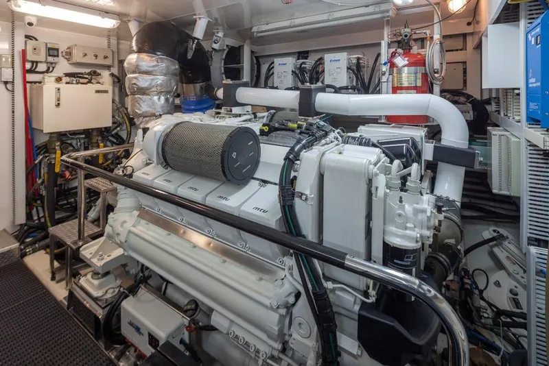 Slide: The Image of Engine room of 2014 Ocean Alexander 85 Cockpit Motoryacht, featuring advanced machinery and equipment. - 64