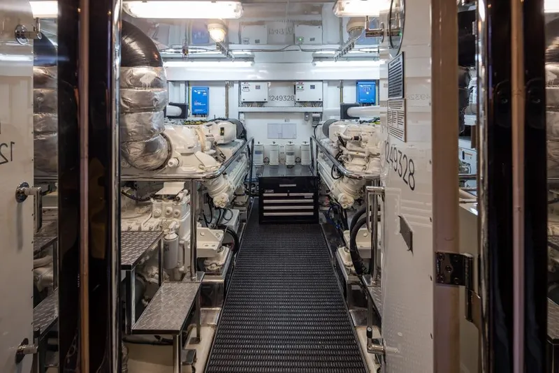 Slide: The Image of Engine room of 2014 Ocean Alexander 85 Cockpit Motoryacht, featuring advanced machinery and equipment. - 65