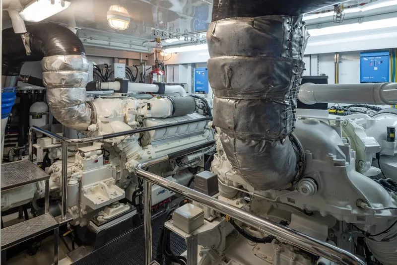 Slide: The Image of Engine room of 2014 Ocean Alexander 85 Cockpit Motoryacht, featuring advanced machinery and equipment. - 66