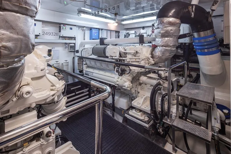 Slide: The Image of Engine room of 2014 Ocean Alexander 85 Cockpit Motoryacht, featuring advanced machinery and equipment. - 68