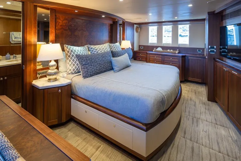 Slide: The Image of Luxurious bedroom in 2014 Ocean Alexander 85 Cockpit Motoryacht with elegant wood finishes. - 7