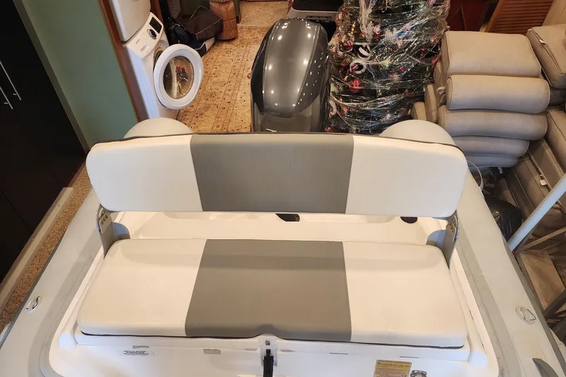 Slide: The Image of 2014 Ocean Alexander 82 Cockpit Motoryacht interior with cushioned seating and storage. - 73