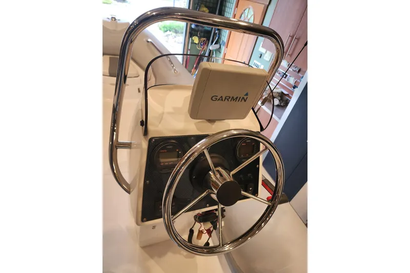 Slide: The Image of Steering wheel and Garmin navigation on 2014 Ocean Alexander 82 Cockpit Motoryacht. - 74