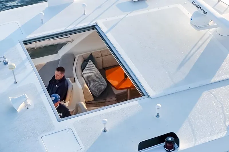 Slide: The Image of 2014 Ocean Alexander 85 Cockpit Motoryacht interior view with seating and cushions. - 8